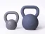 A set of grey and silver steel kettlebells StrongGear